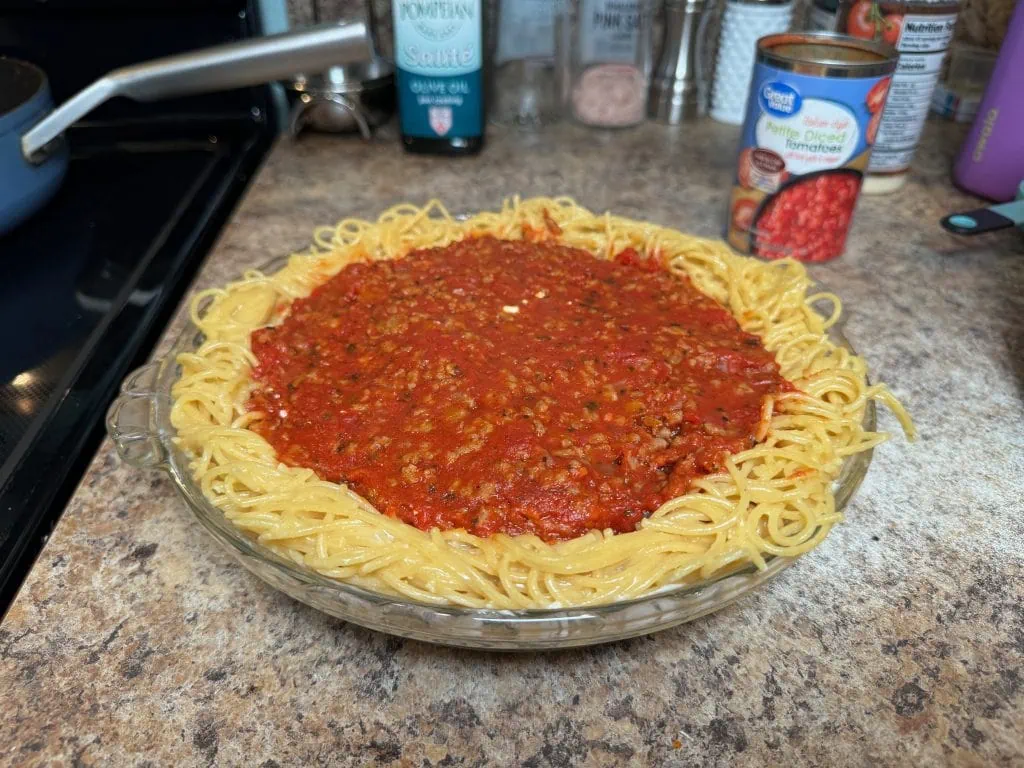 Meat sauce layer in spaghetti crust