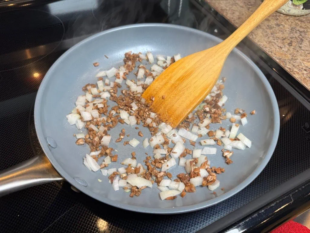 Stems and onions in skillet