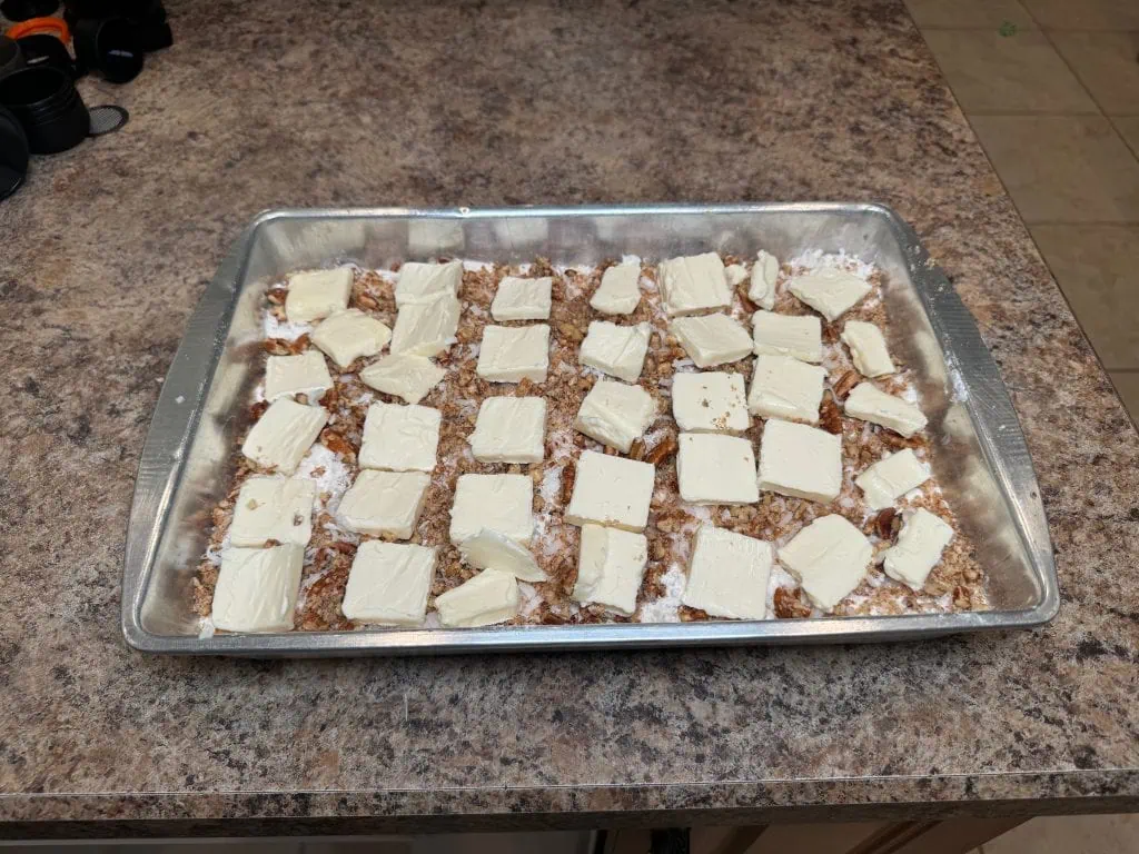 Layered nuts and butter pats.